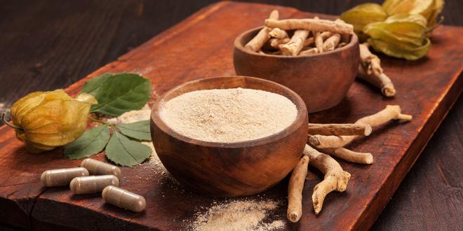 a tray with ashwagandha root, powder, and supplements