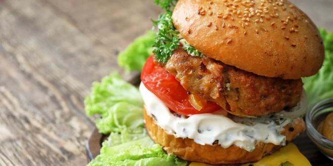 Turkey burger on a rustic wooden table background