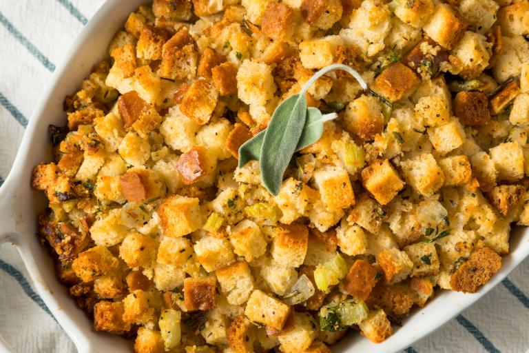 a baking dish full of gluten-free stuffing with nuts and fruit